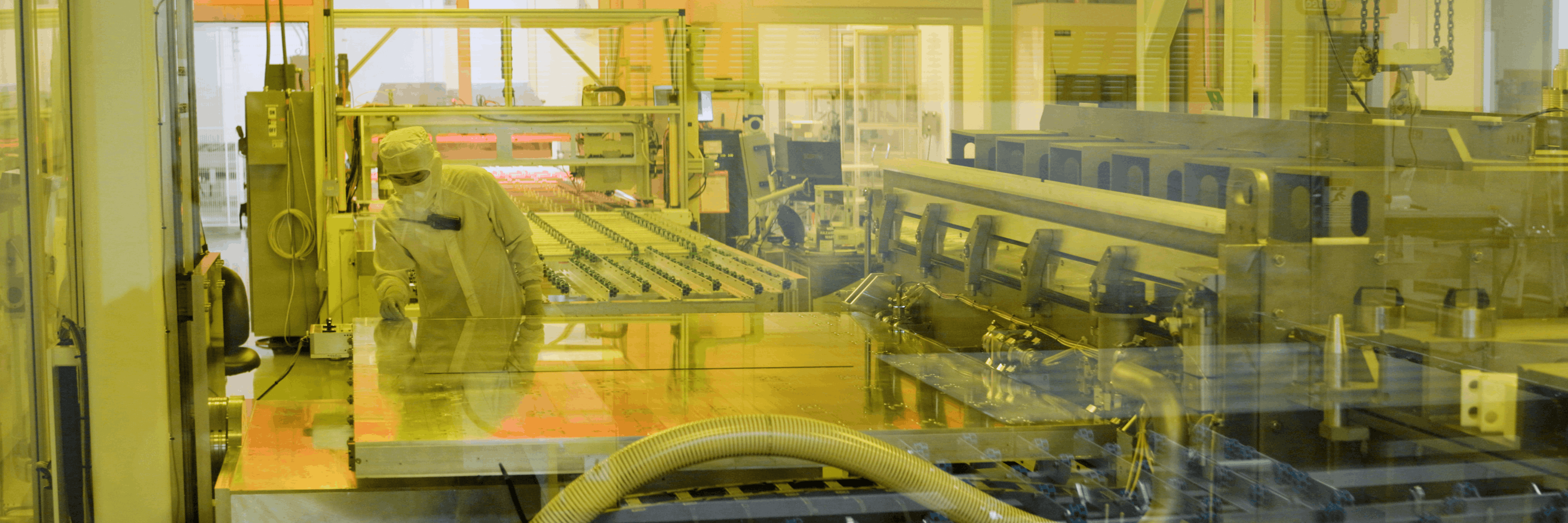 Cardinal CLiC employee examining glass