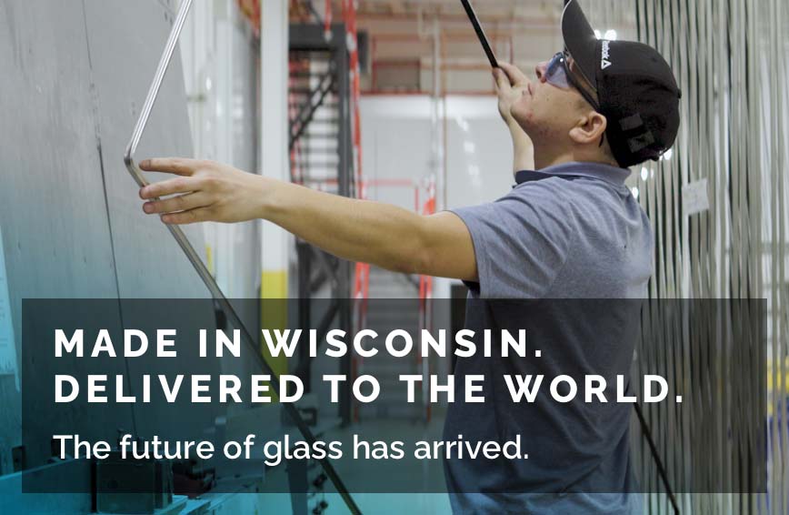 An installer finishes installing CLiC Glass windows in a home.