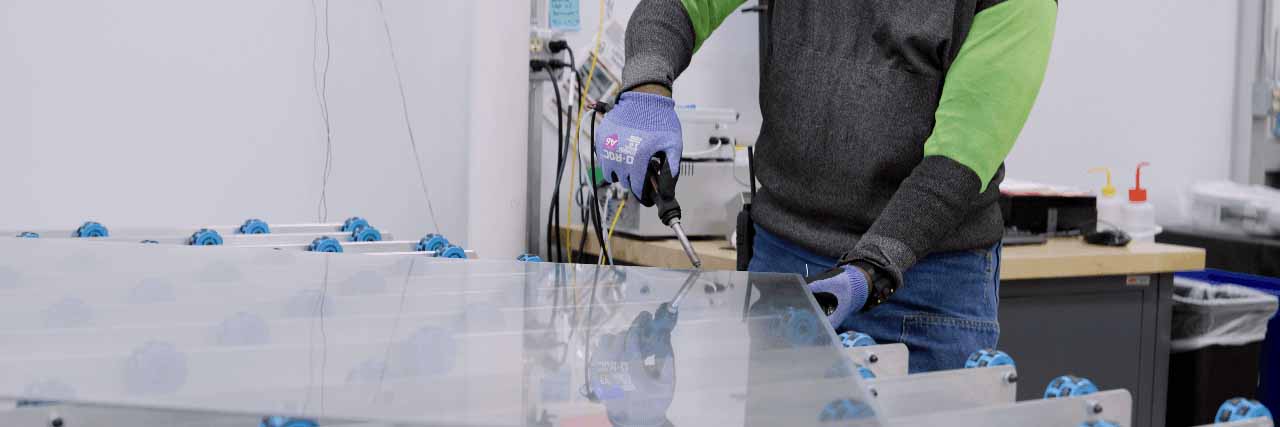 Cardinal CLiC employee working on CLiC Glass Cardinal CLiC employee working on CLiC Glass