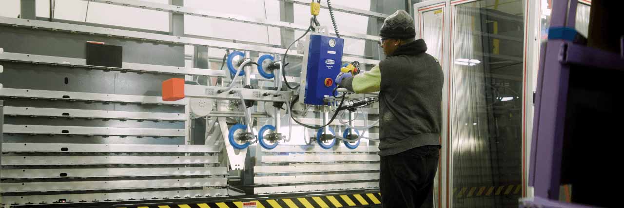 Cardinal Employee working with a robot